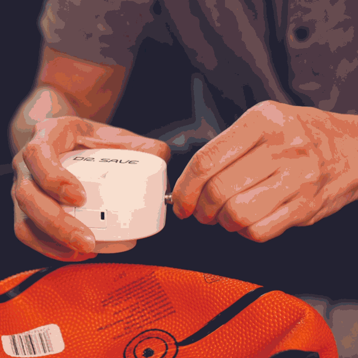 DR. SAVE DUO inflating a basketball with the ball needle